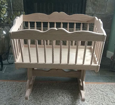 unstained light wood bassinet