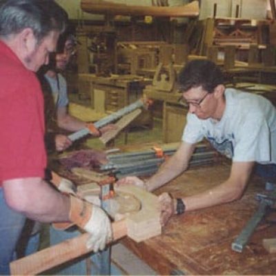 working together on bending wood in a frame