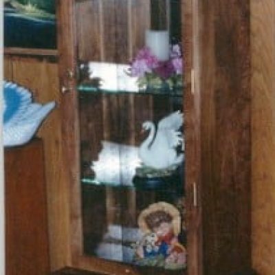 curio cabinet with decorations in it