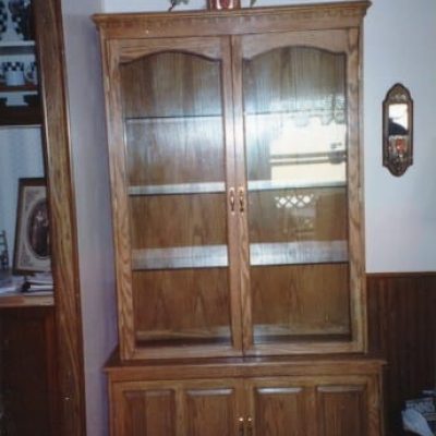 stand curio cabinet with glass shelves and doors